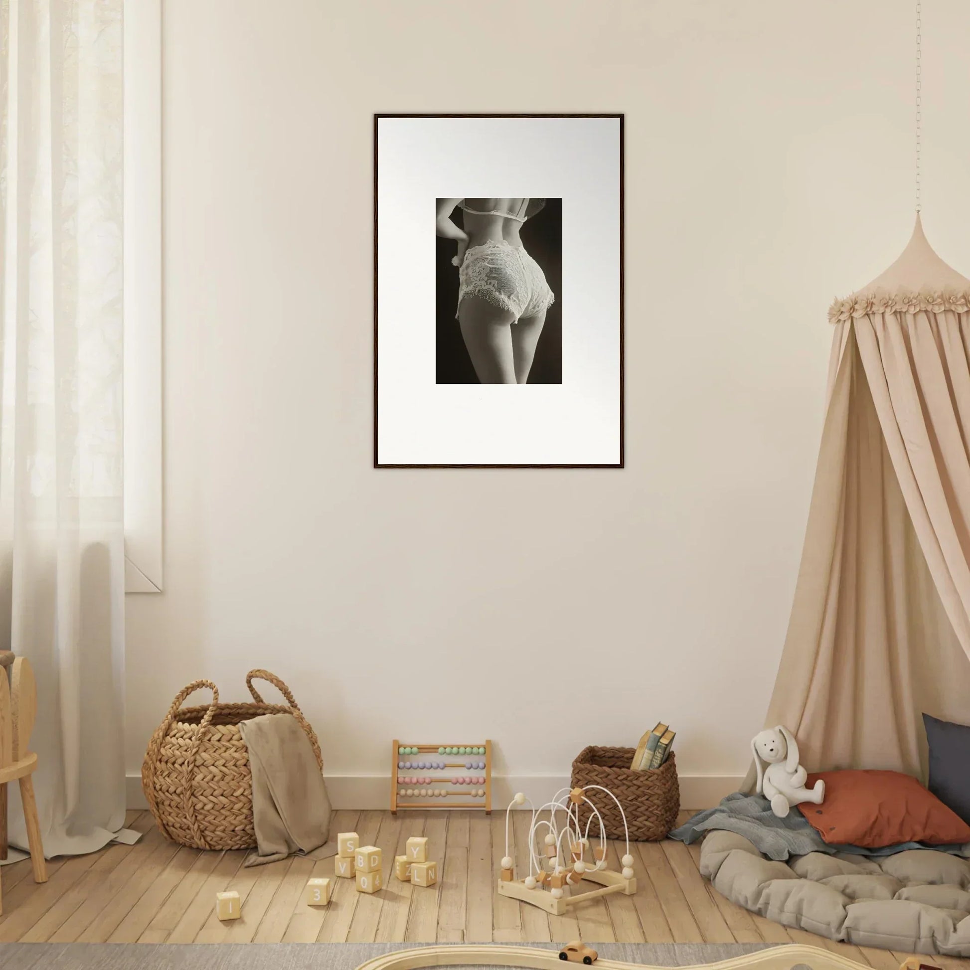 Framed black and white canvas print of woman’s torso showcasing seductive lace curvature