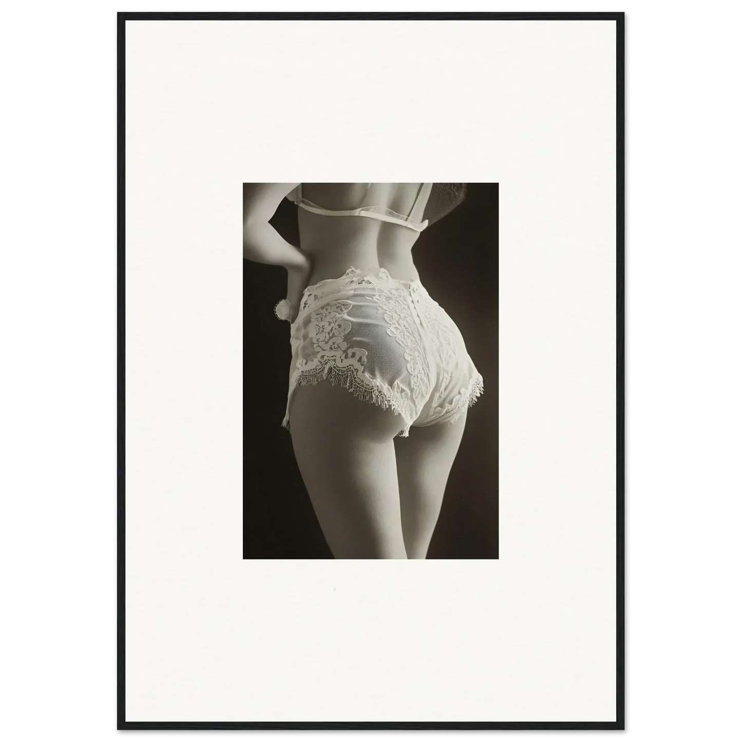 Woman’s lower back in lacy white underwear highlighting lace curvature for decor