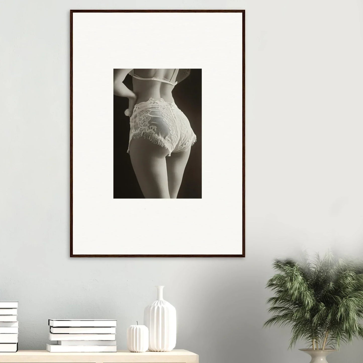 Framed black and white canvas print of lace curvature on a woman’s hips for chic room decoration