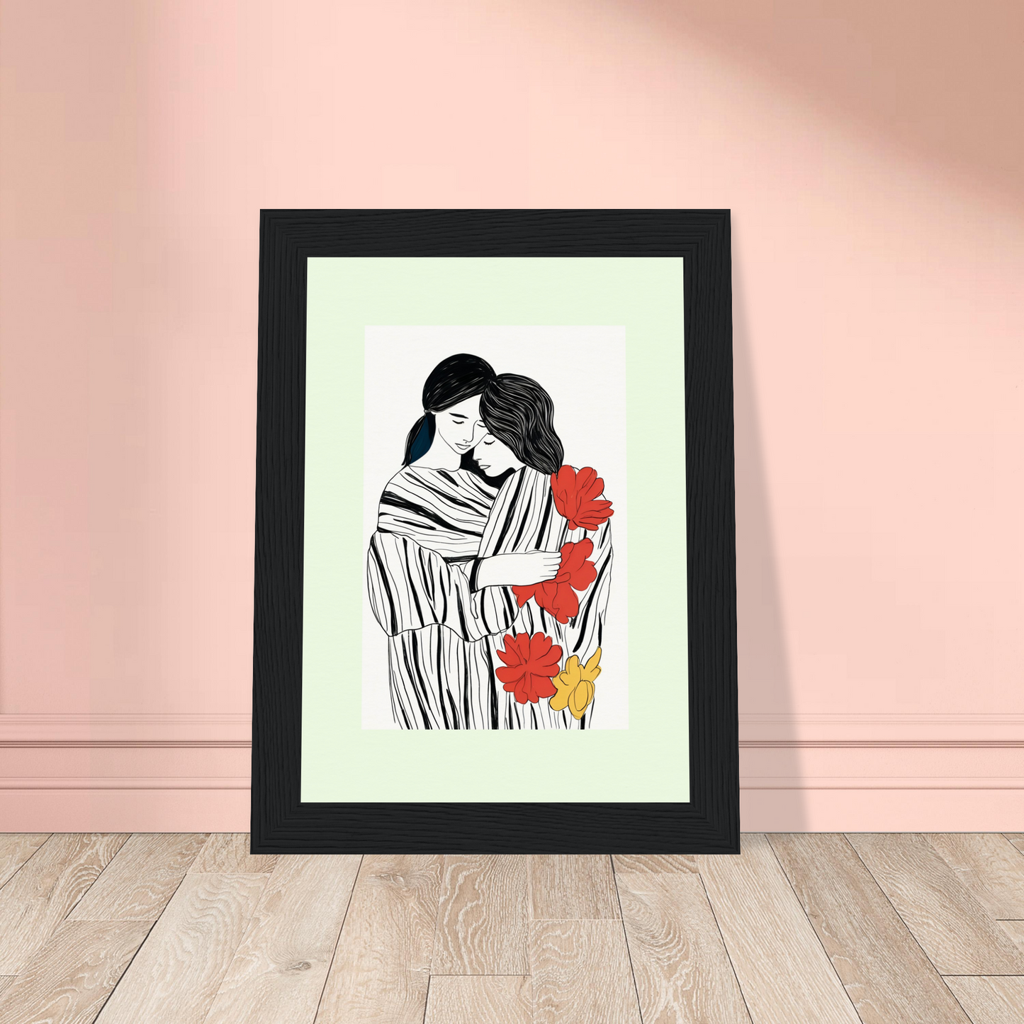 Framed artwork depicting a couple embracing among red and yellow flowers.