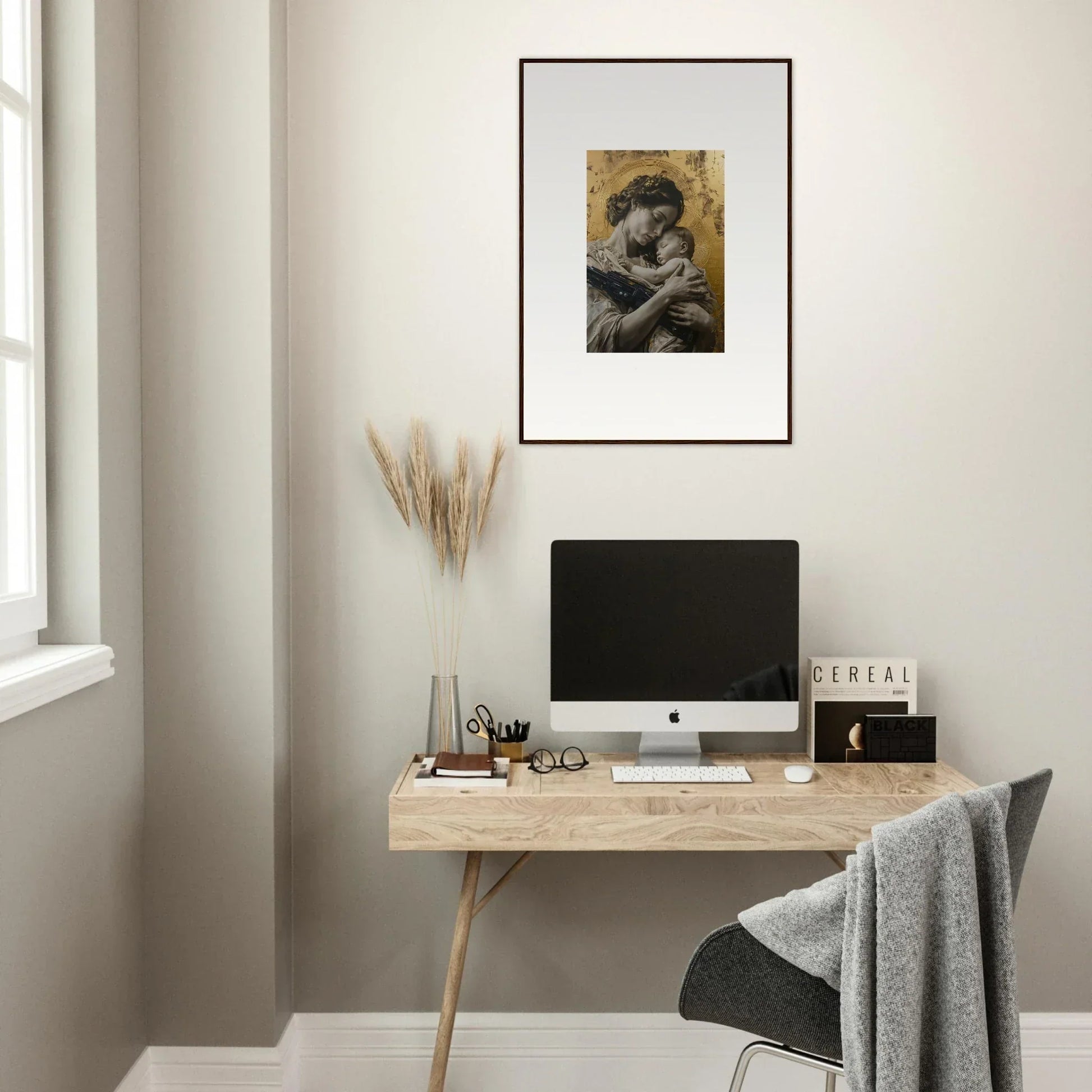 Minimalist home office with wooden desk, computer, and framed wall art in Delta Redux decor