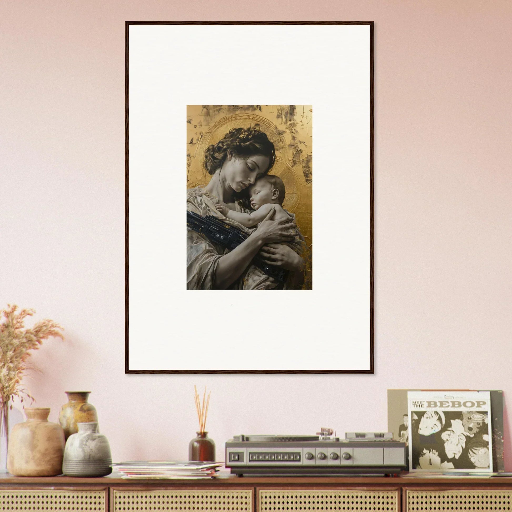 Framed wall art of a woman holding a baby against a golden background in Delta Redux