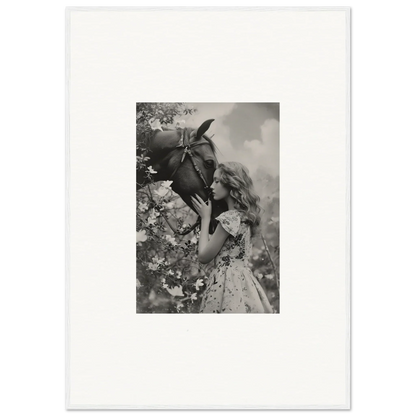 Young girl holding a large flower in a black and white canvas print for Lunar Reverie room decoration