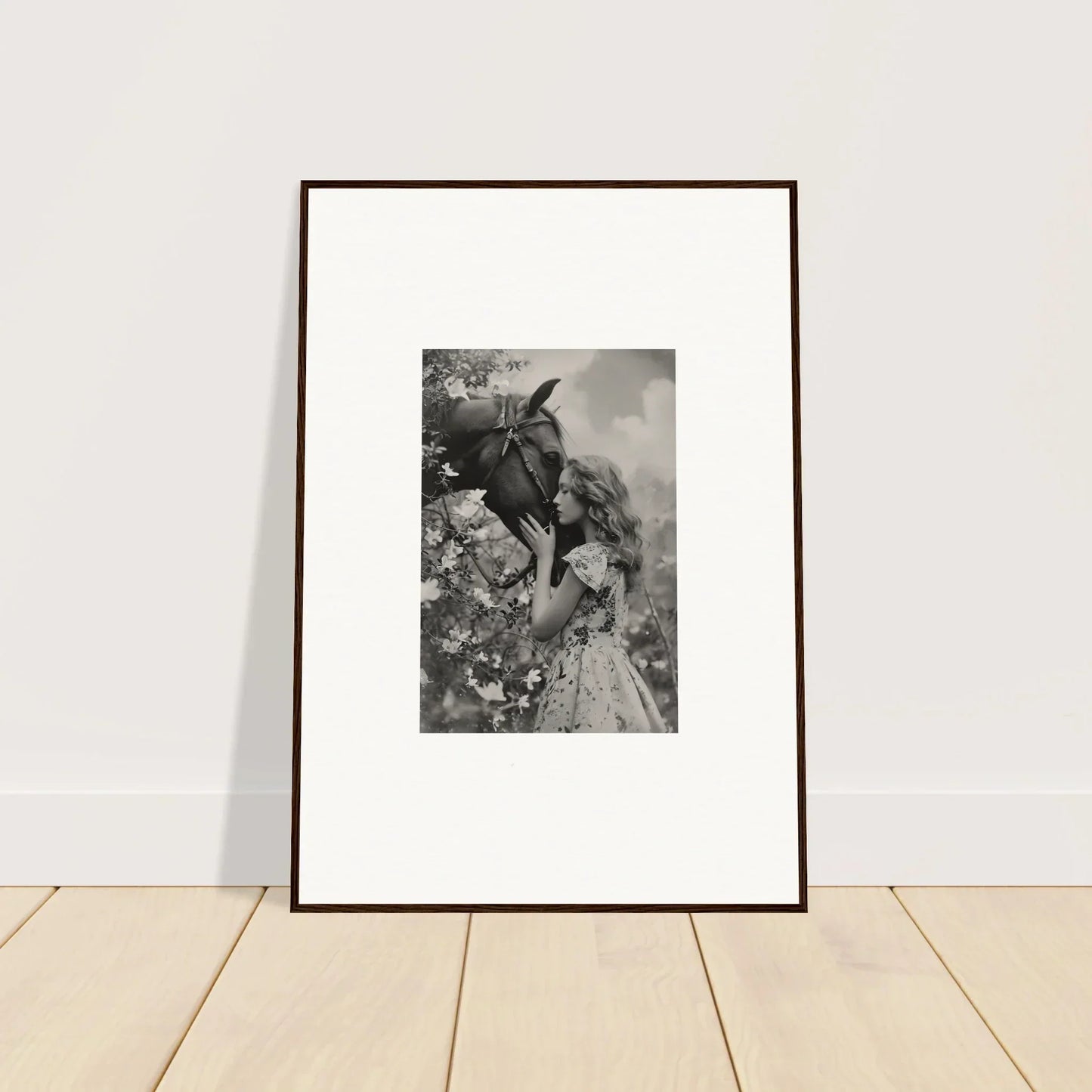 Framed black and white photo of a donkey mask with a floral dress for room decoration