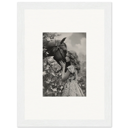 Young girl smelling a flower in black and white, perfect for Lunar Reverie room decoration