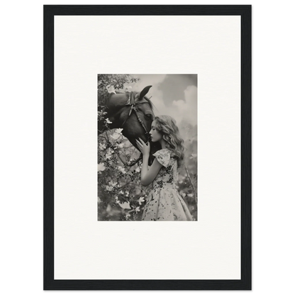 Black and white photo of a girl smelling a flower - perfect for Lunar Reverie room decoration