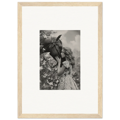 Framed black and white photo of a girl with a flower, perfect for Lunar Reverie room decoration