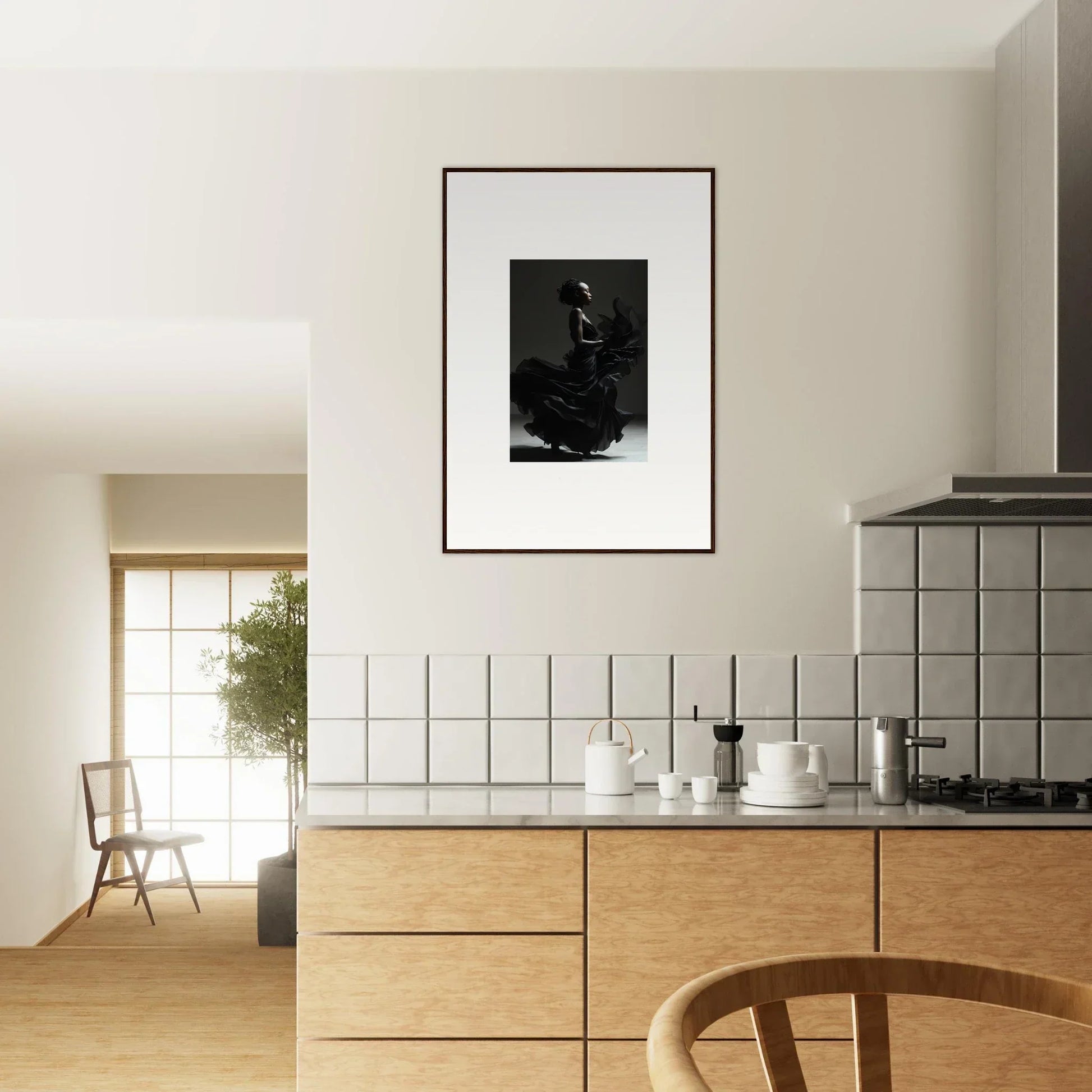 Modern kitchen with wooden cabinetry and a framed black and white photograph on the wall.