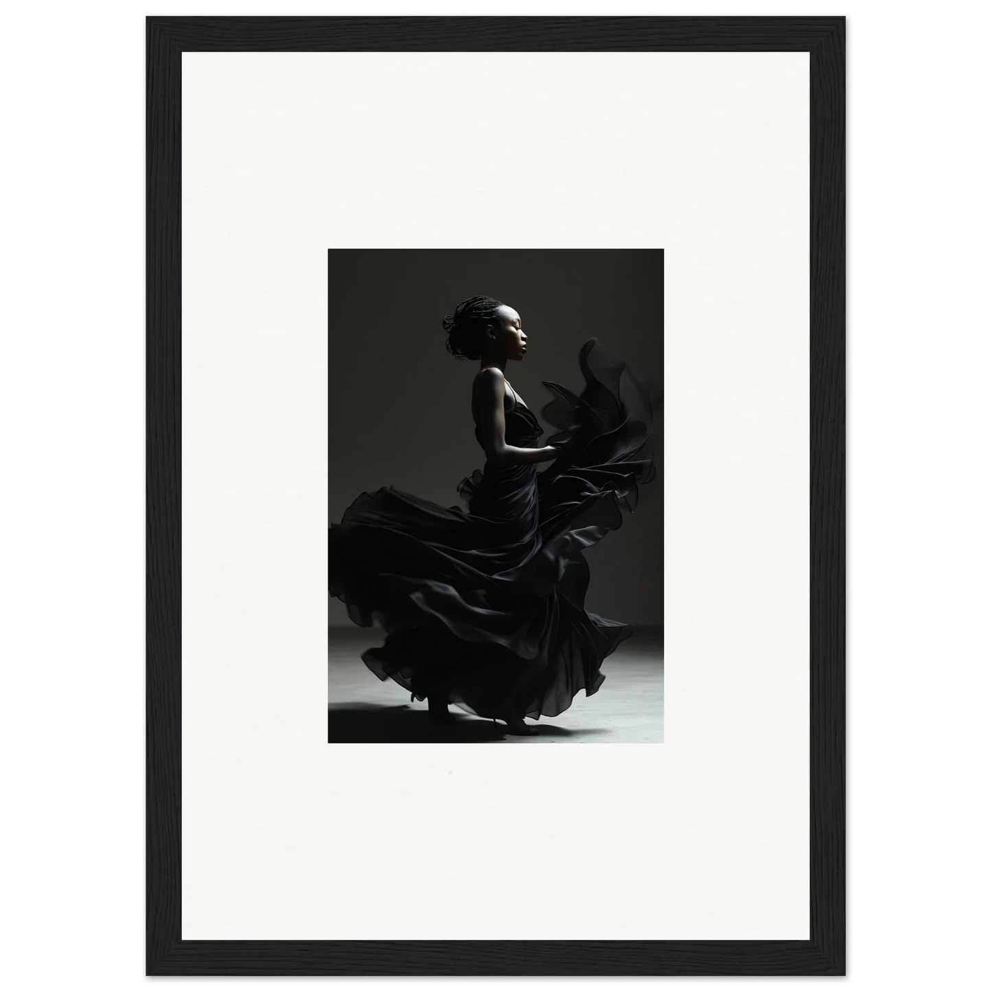 Silhouette of a flamenco dancer in dramatic motion.