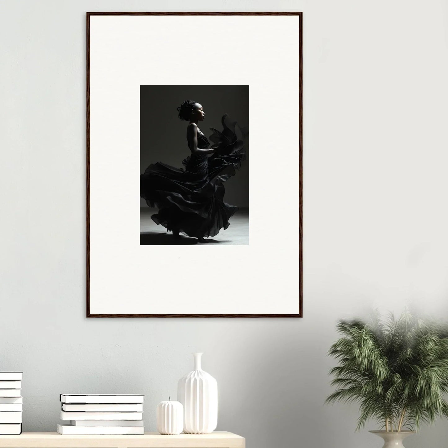 Framed black and white photograph of a flamenco dancer in dramatic motion.