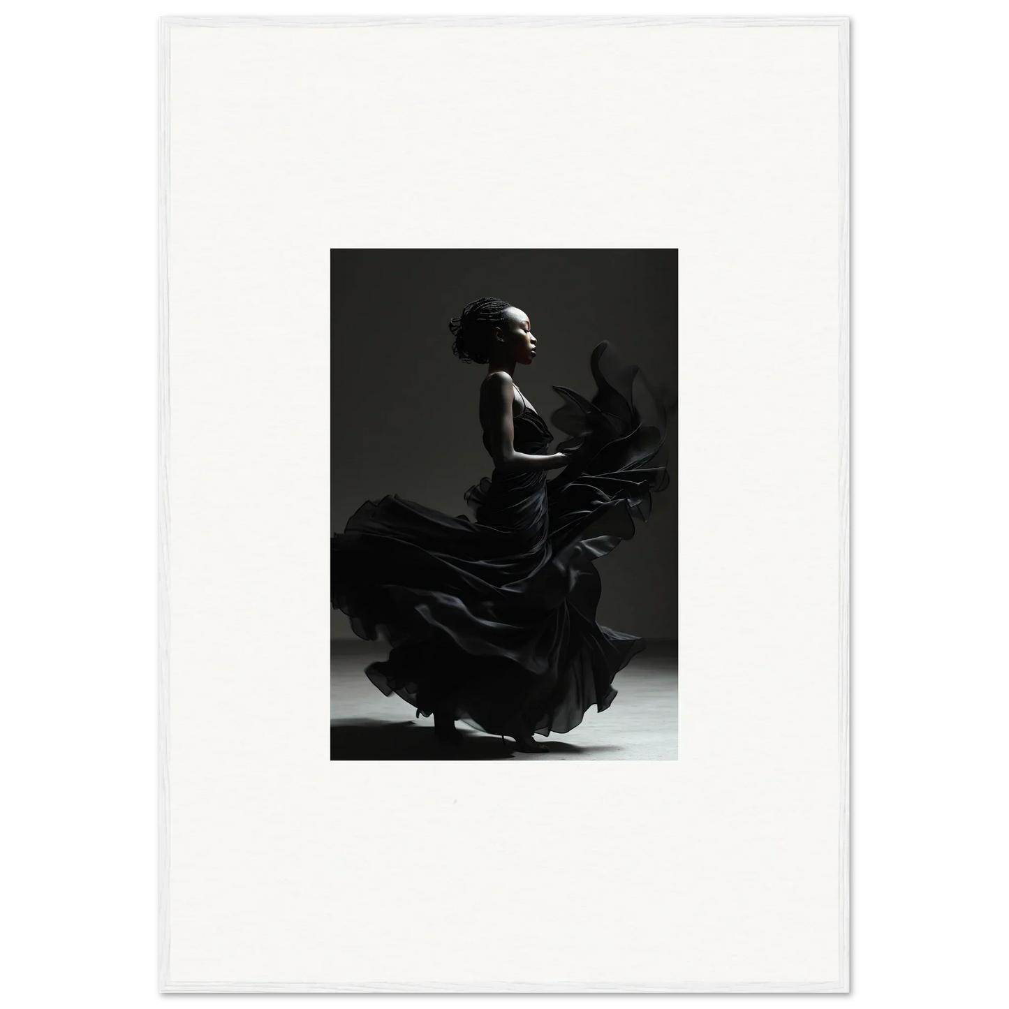 Silhouette of a flamenco dancer in a dramatic pose with a flowing ruffled dress.