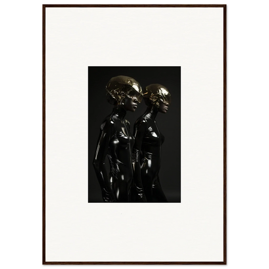 Dark metallic sculpture depicting two stylized humanoid figures standing close together.