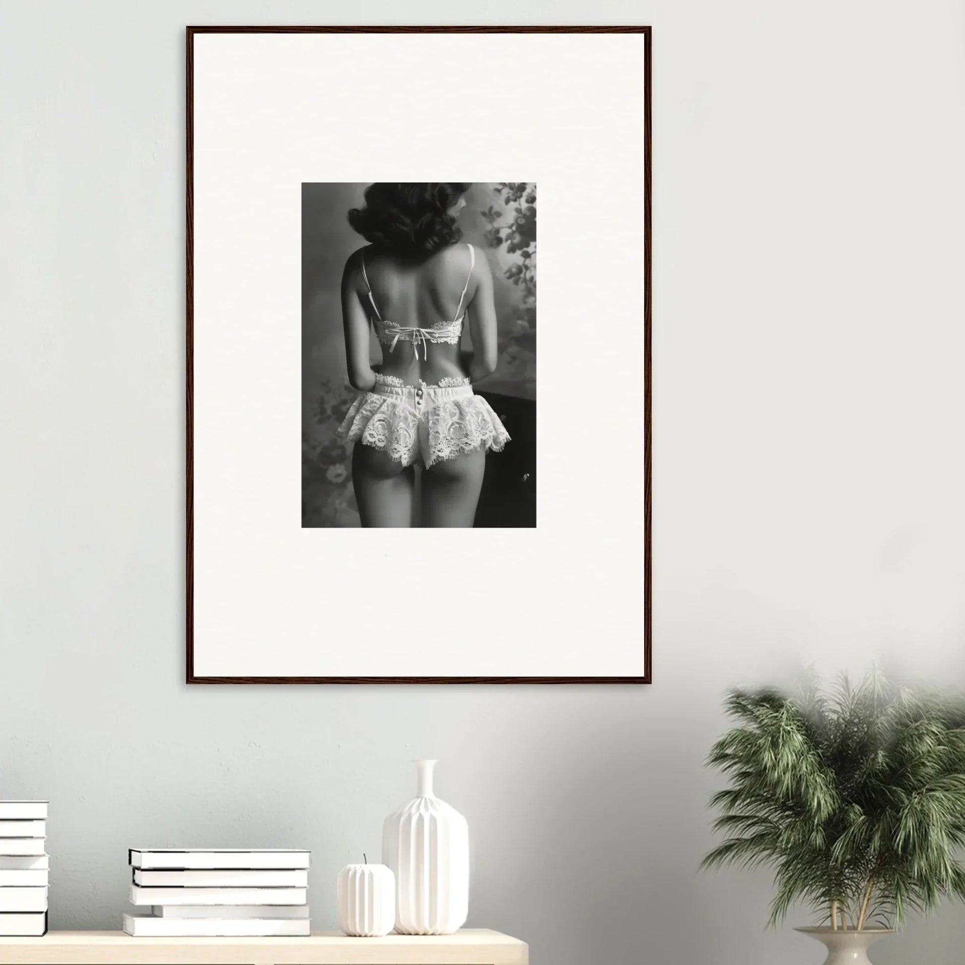 Framed black and white image of a person in a lacy skirt, perfect for room decor