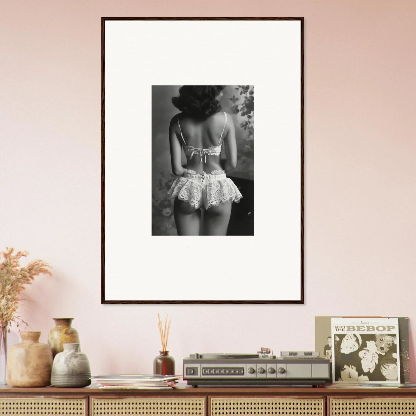 Framed black and white wall art of a woman’s back in a lacy tutu for elegant room decor