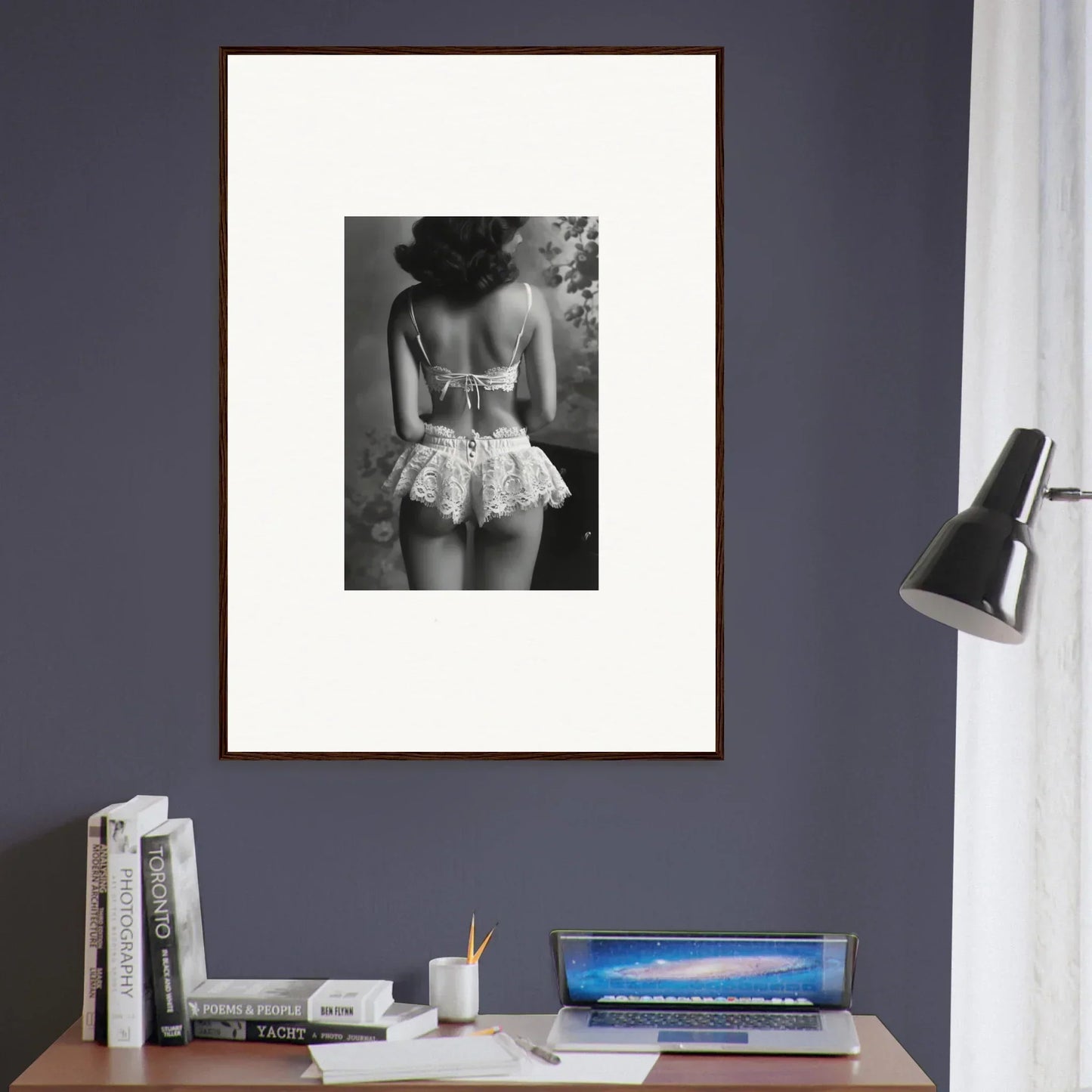 Framed black and white photograph of person in lacy shorts for stylish room decor