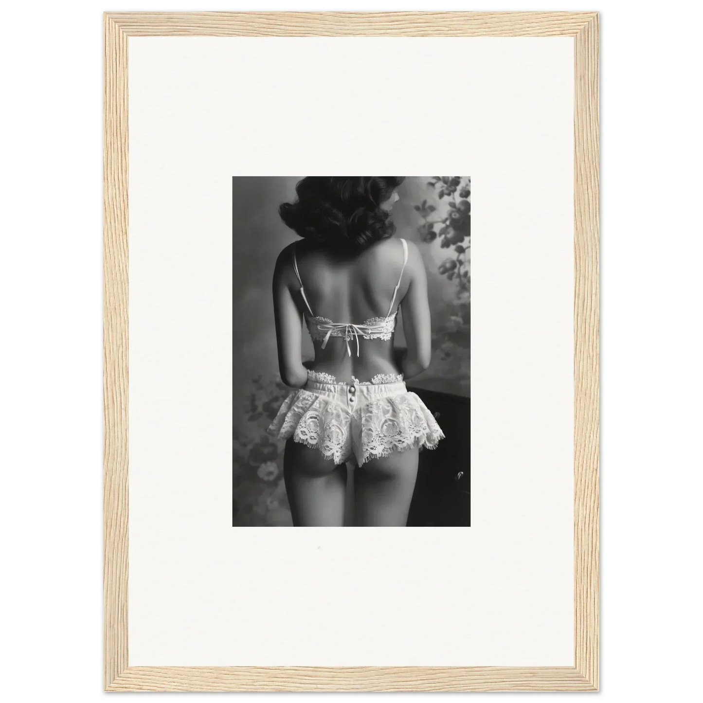 Black and white photo of a woman in lacy lingerie, ideal for silk fawns room decor