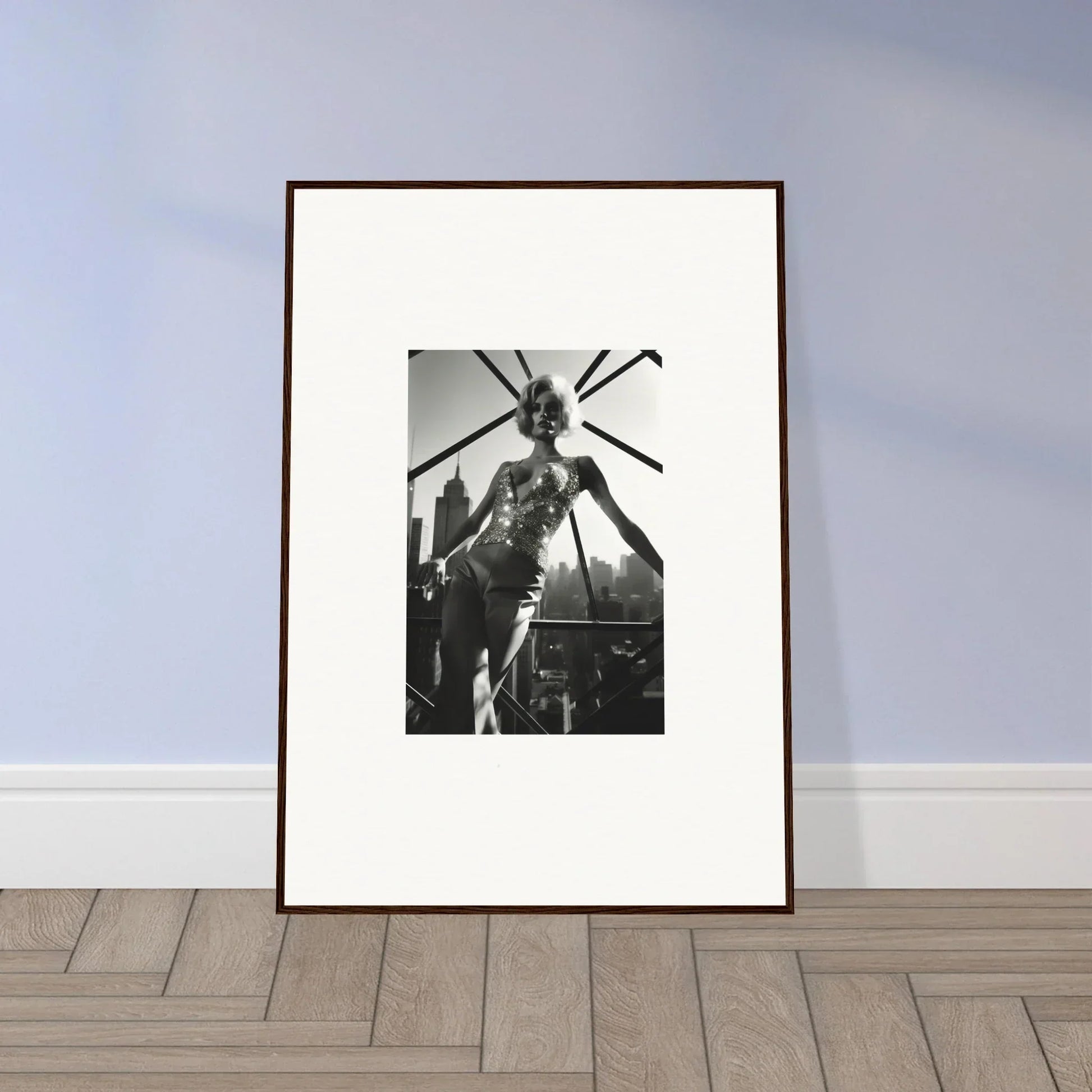 Framed black and white photograph of a person in an elaborate headdress or costume.