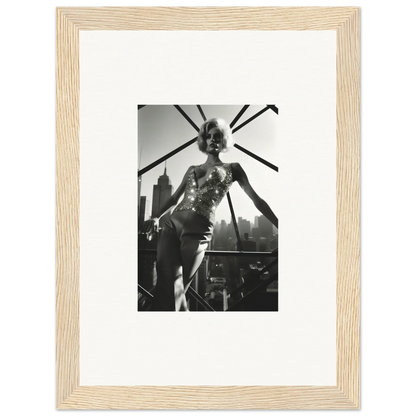 Black and white photograph of a performer on stage, framed in a light wooden frame with a white mat.