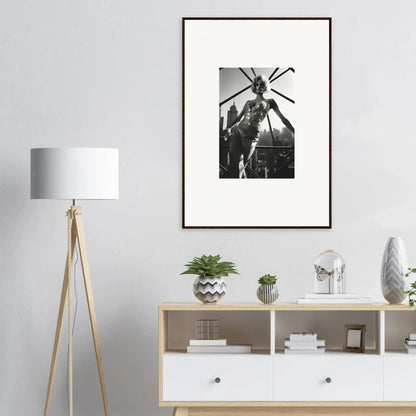 Framed black and white photograph of a person standing beneath a helicopter rotor.