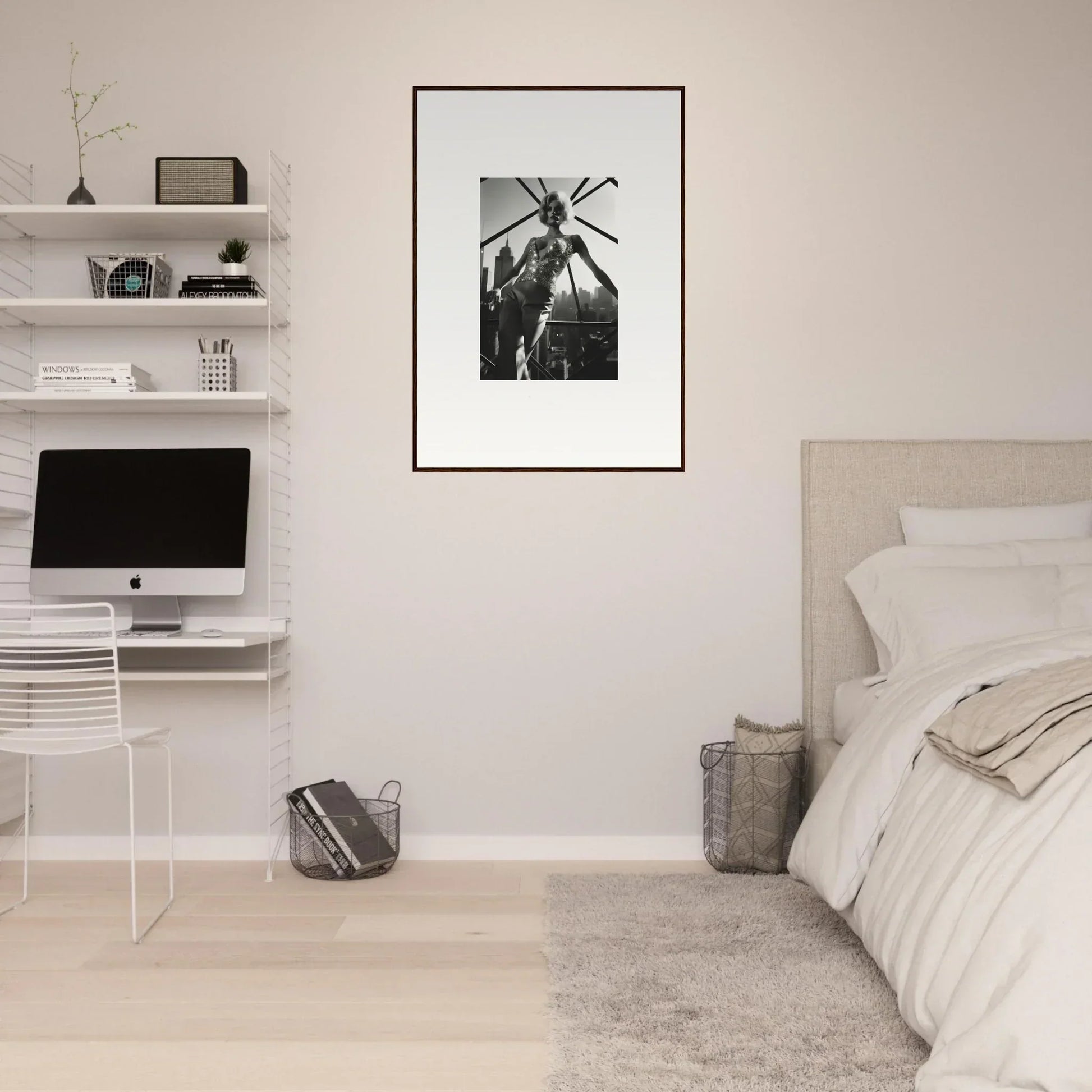 Minimalist bedroom with a framed black and white photograph as the focal point.