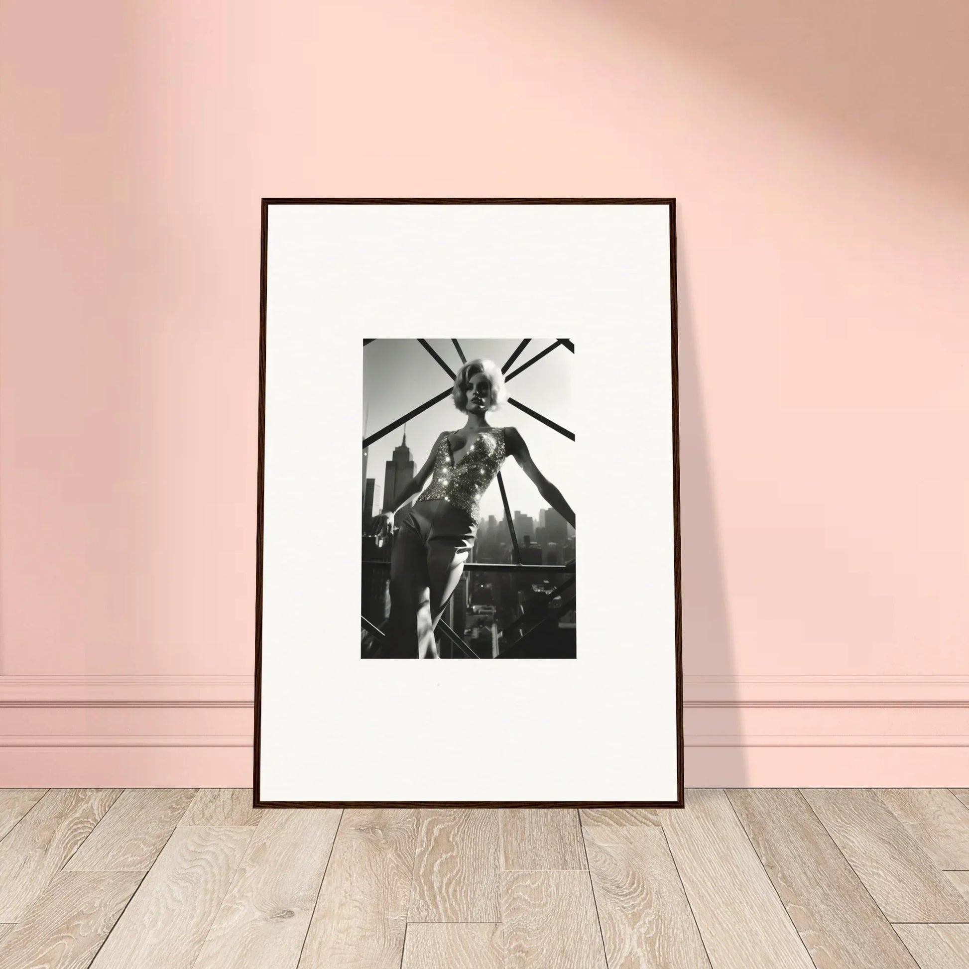 Framed black and white photograph of a person jumping or leaping outdoors.