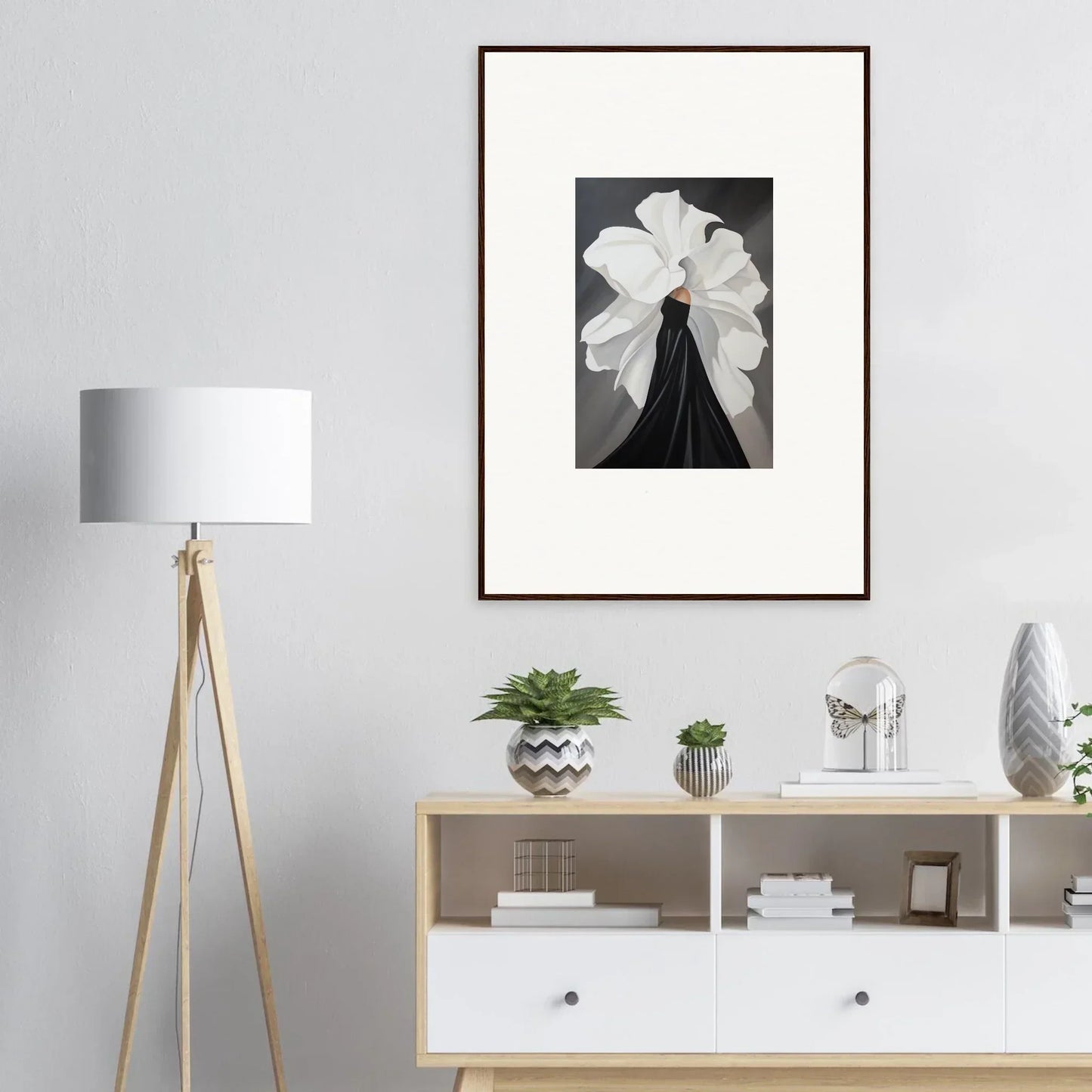 Framed black and white wall art of a person with a white headdress for elegant room decor