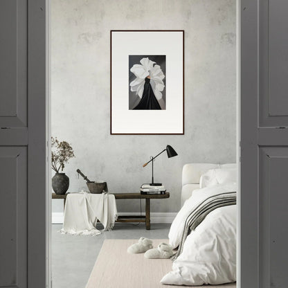 Framed black and white wall art featuring a figure with dramatic floral headdress for chic room decor