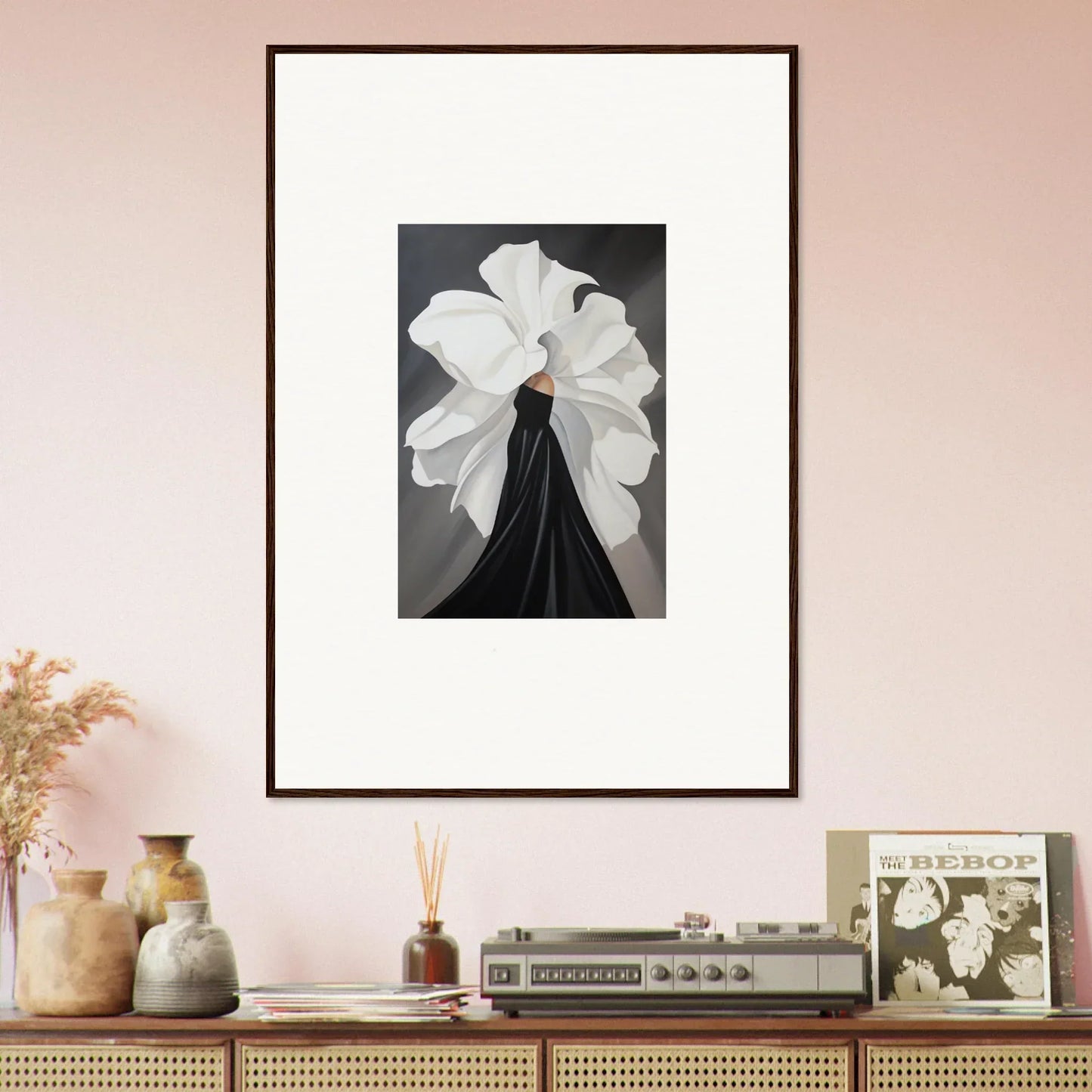 Framed black and white art of a figure with a white headdress for elegant room decor