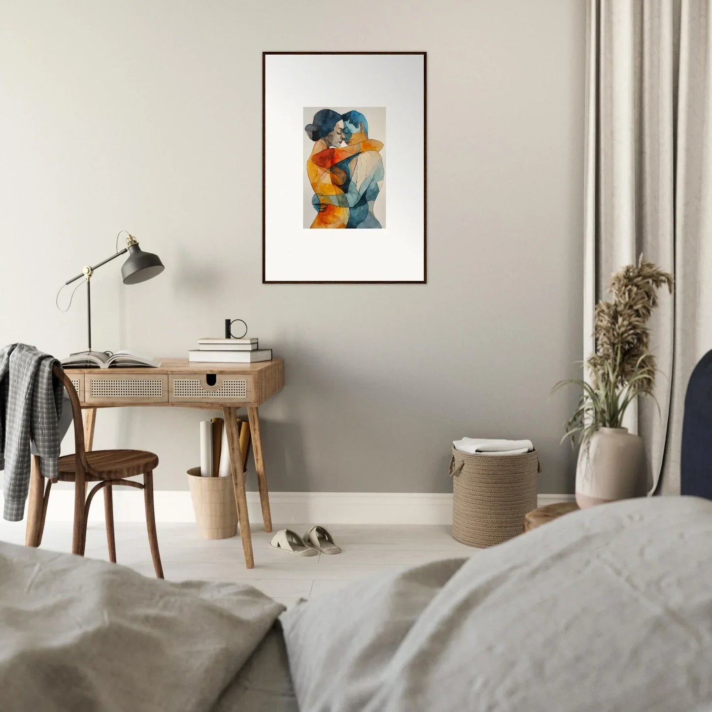 Framed abstract watercolor of embracing figures in blue and orange hues for room decor