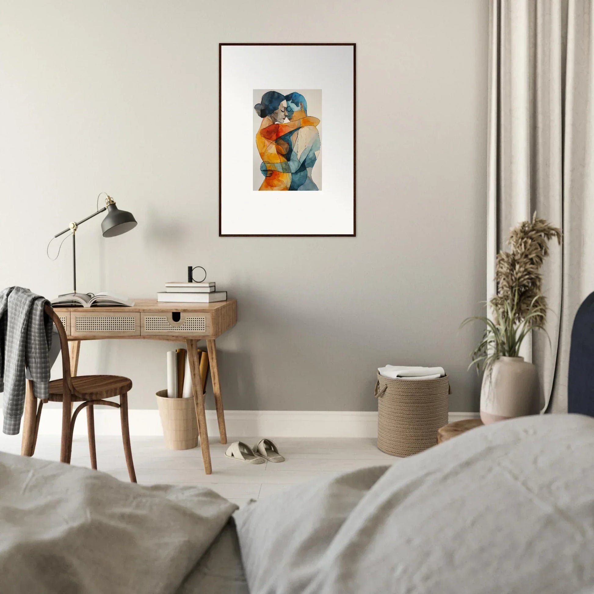 Framed abstract watercolor of embracing figures in blue and orange hues for room decor