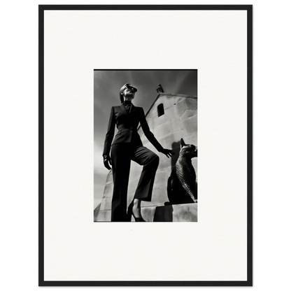 Black and white photograph of a woman in a tailored suit posing next to a sculptural form.