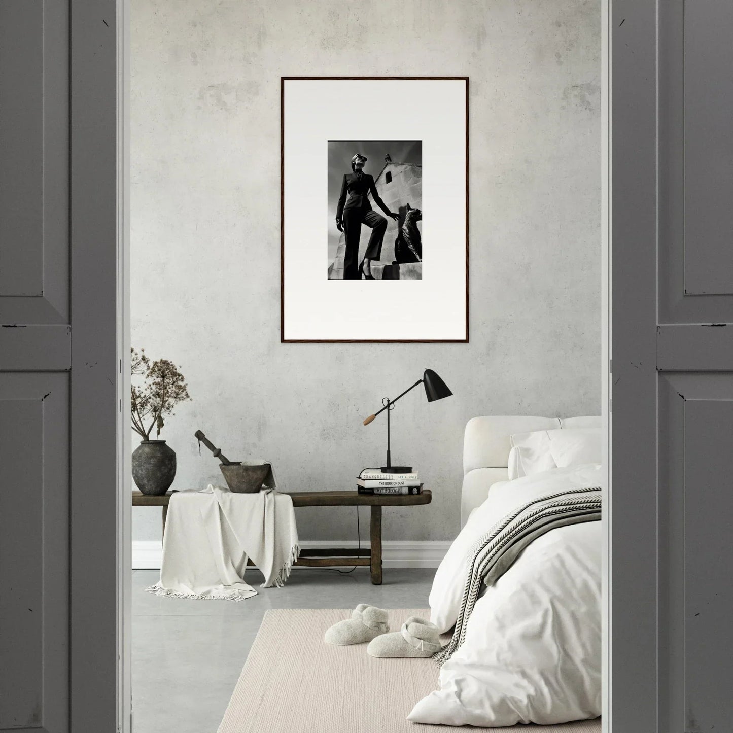 Framed black and white photograph hanging on a wall.