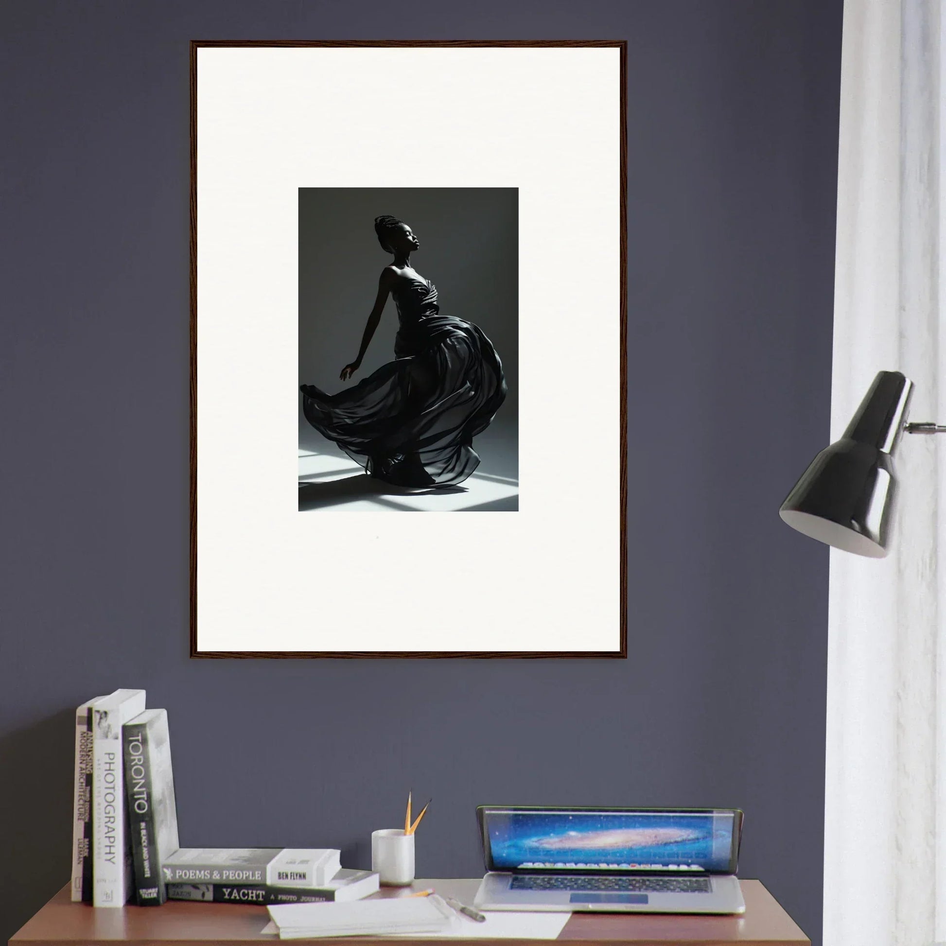 Framed black and white photograph of a dancer in a flowing dress.