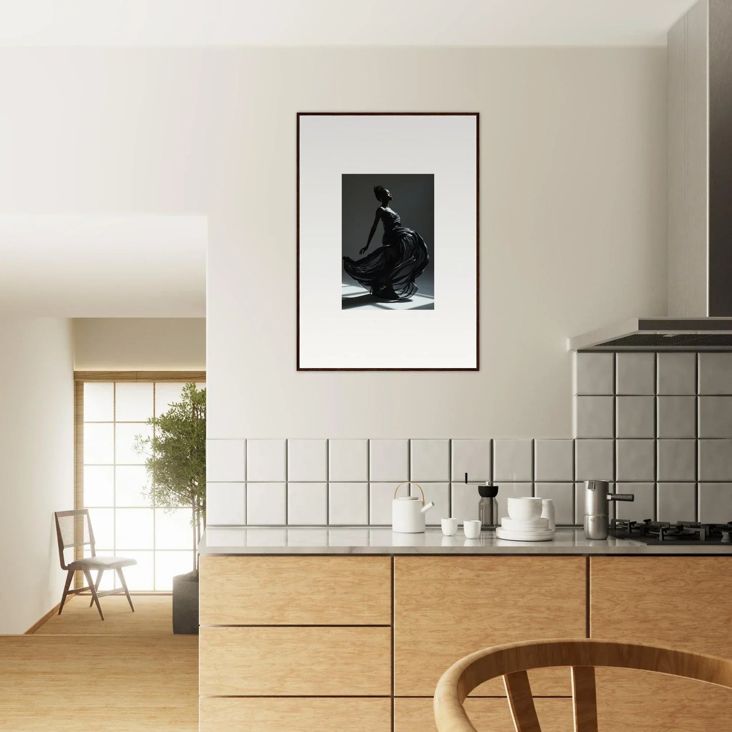 Modern kitchen with wooden cabinetry and a framed black-and-white photograph on the wall.