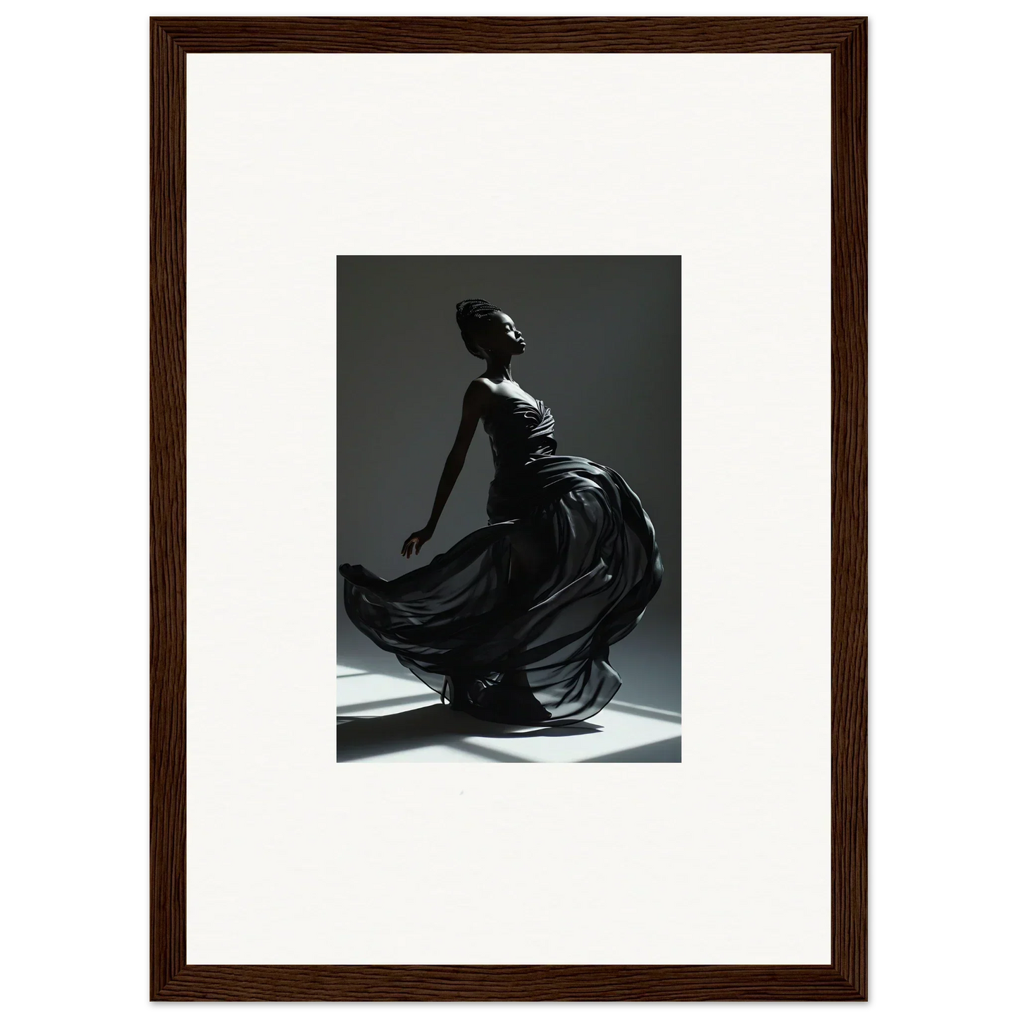 Graceful dancer in a flowing dark dress captured mid-movement.