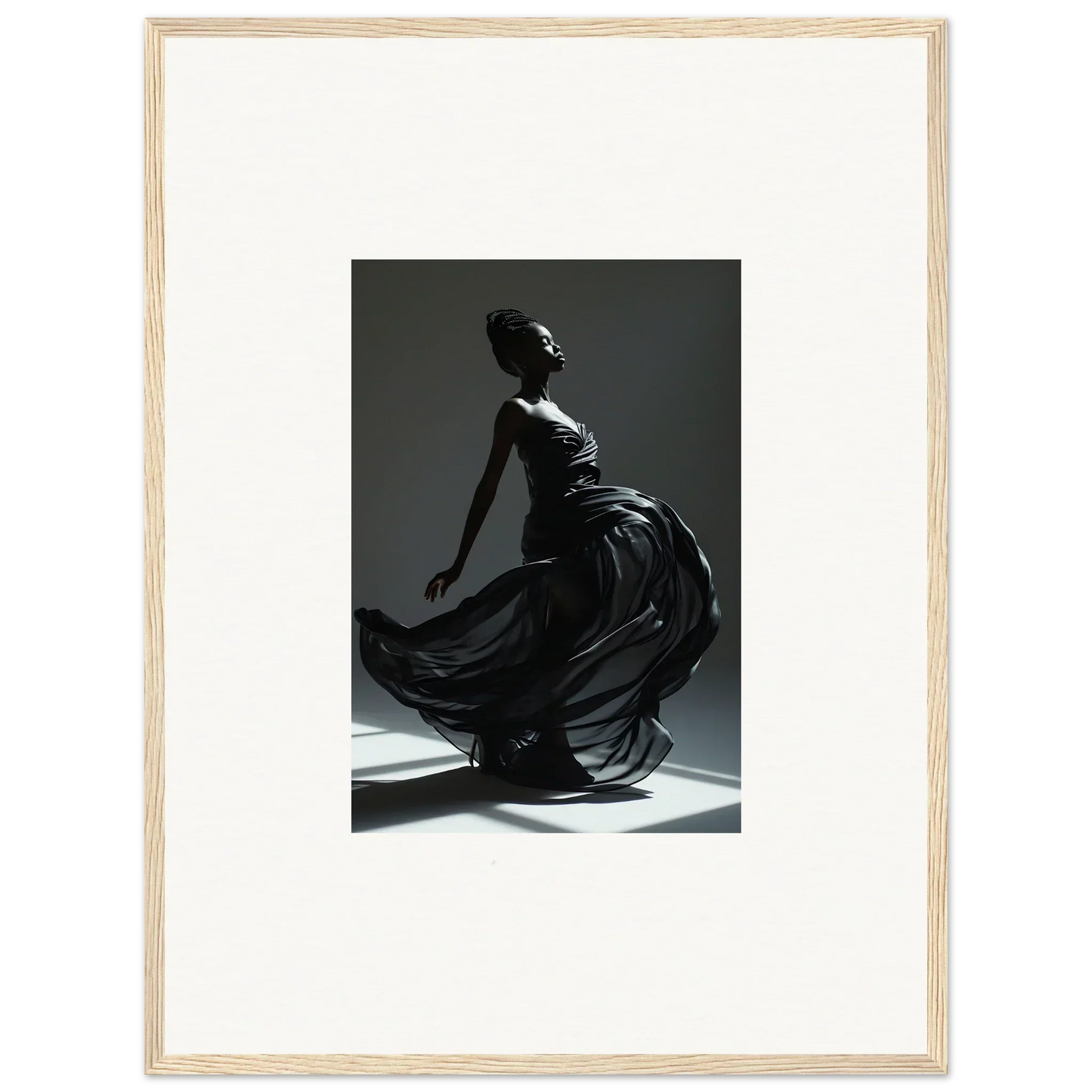 Silhouette of a graceful dancer in a flowing dress captured mid-movement.