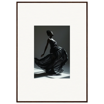 Elegant silhouette of a woman in a flowing black dress, captured mid-movement.