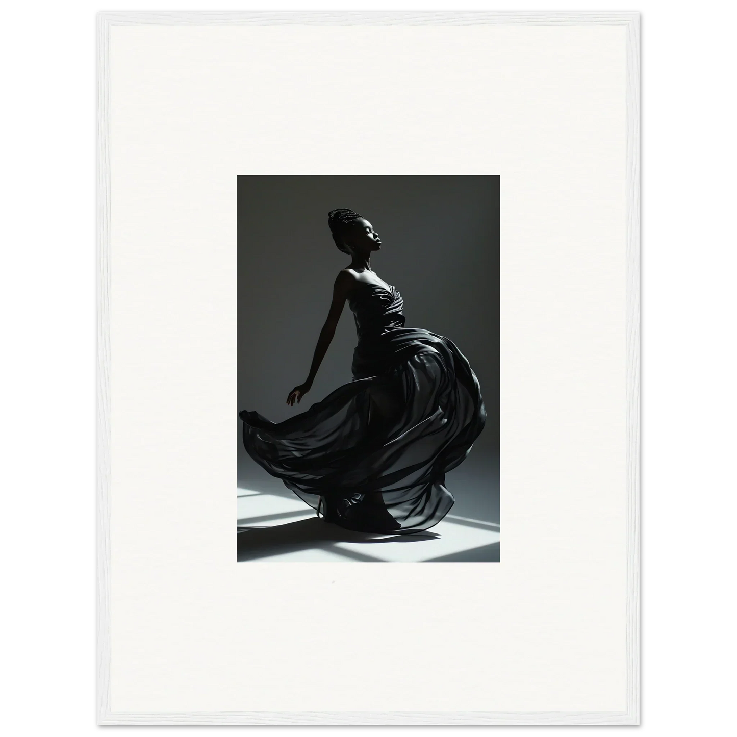 Elegant silhouette of a woman in a flowing dress, captured mid-movement.