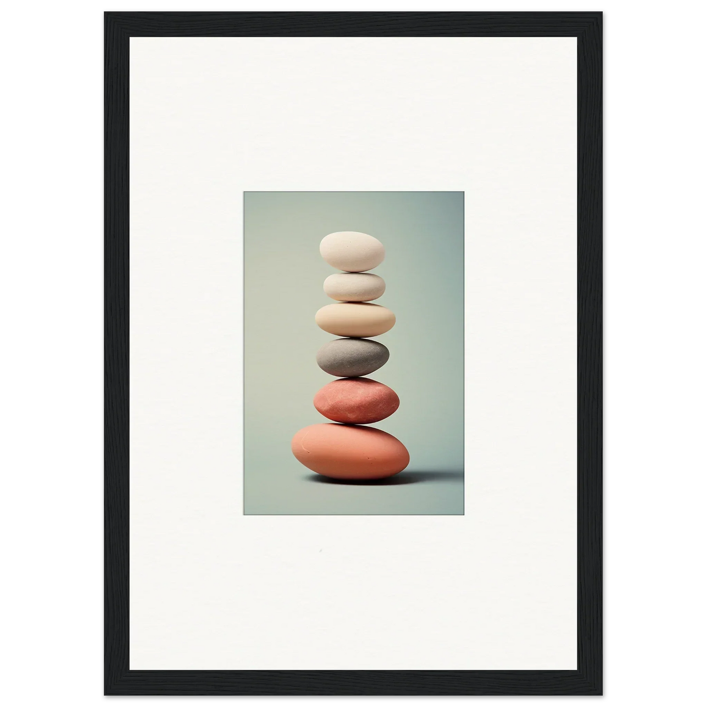 Stack of smooth stones in white, gray, and coral for elegant room decor or canvas prints