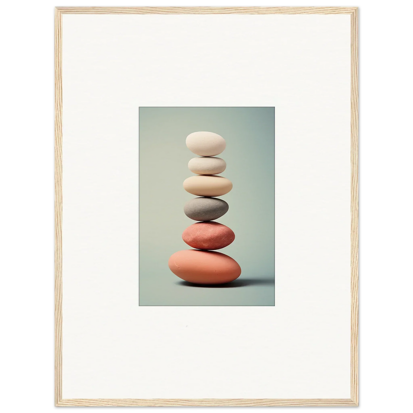 Stack of smooth stones in white, gray, and coral for elegant room decor and wall art