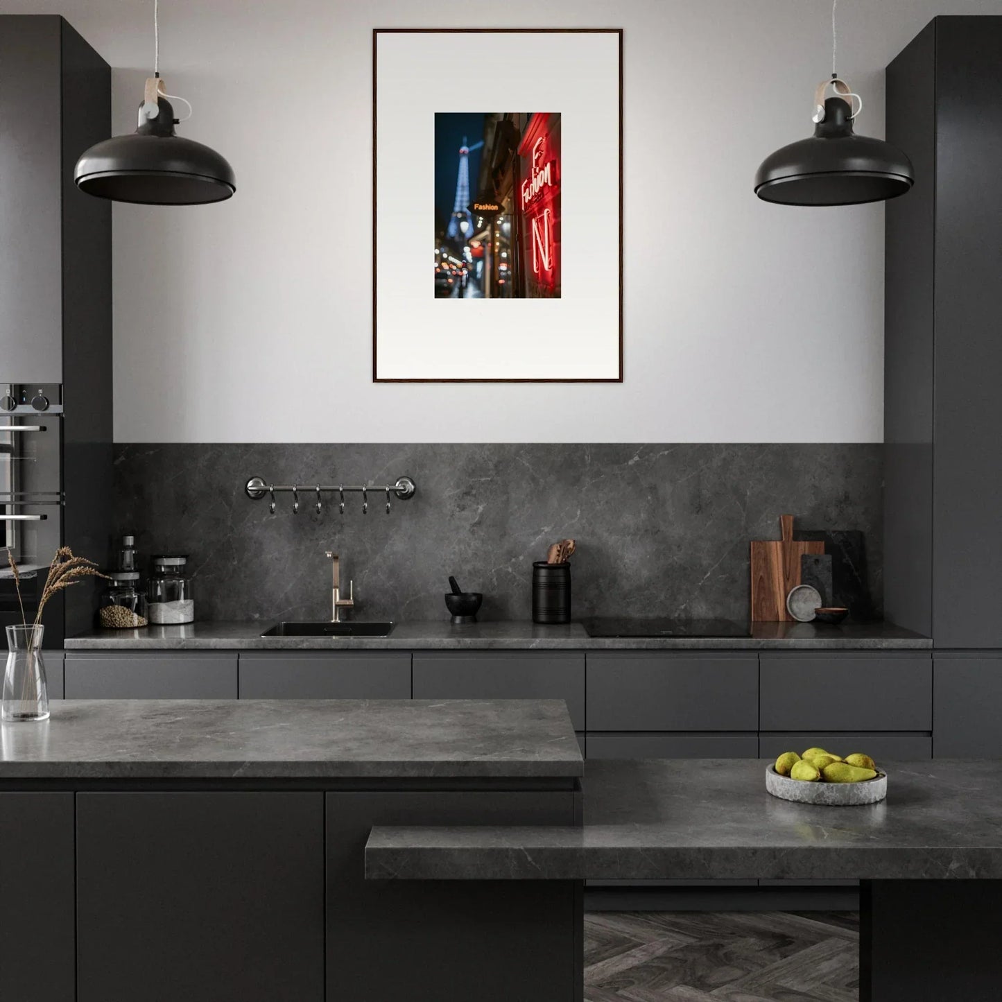 Modern kitchen with dark cabinetry, pendant lights, and colorful framed wall art