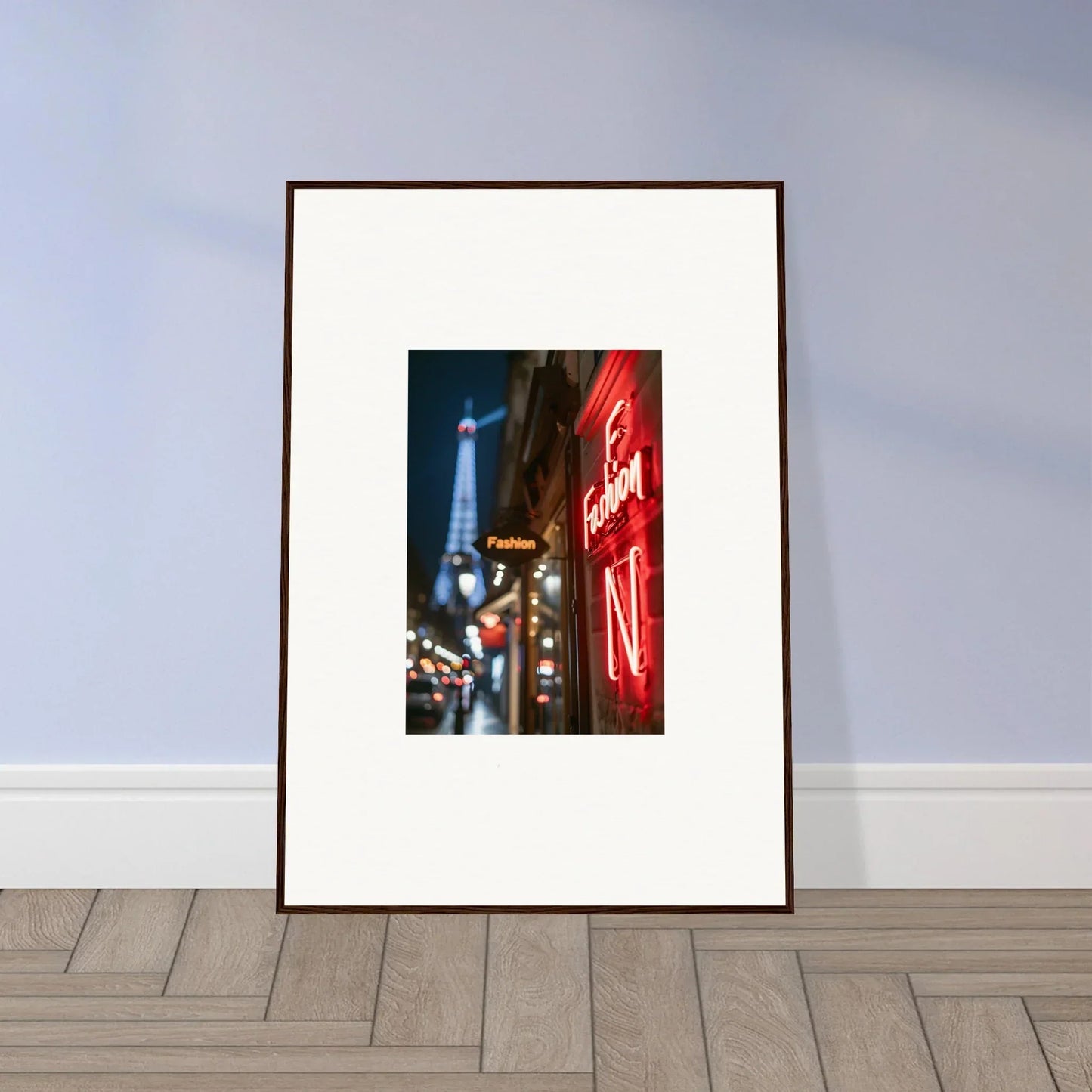 Framed wall art of a Paris street scene with the Eiffel Tower and neon whispers