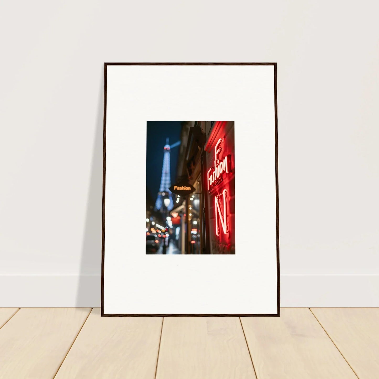 Framed wall art of a Parisian street with the Eiffel Tower and neon whispers for room decor