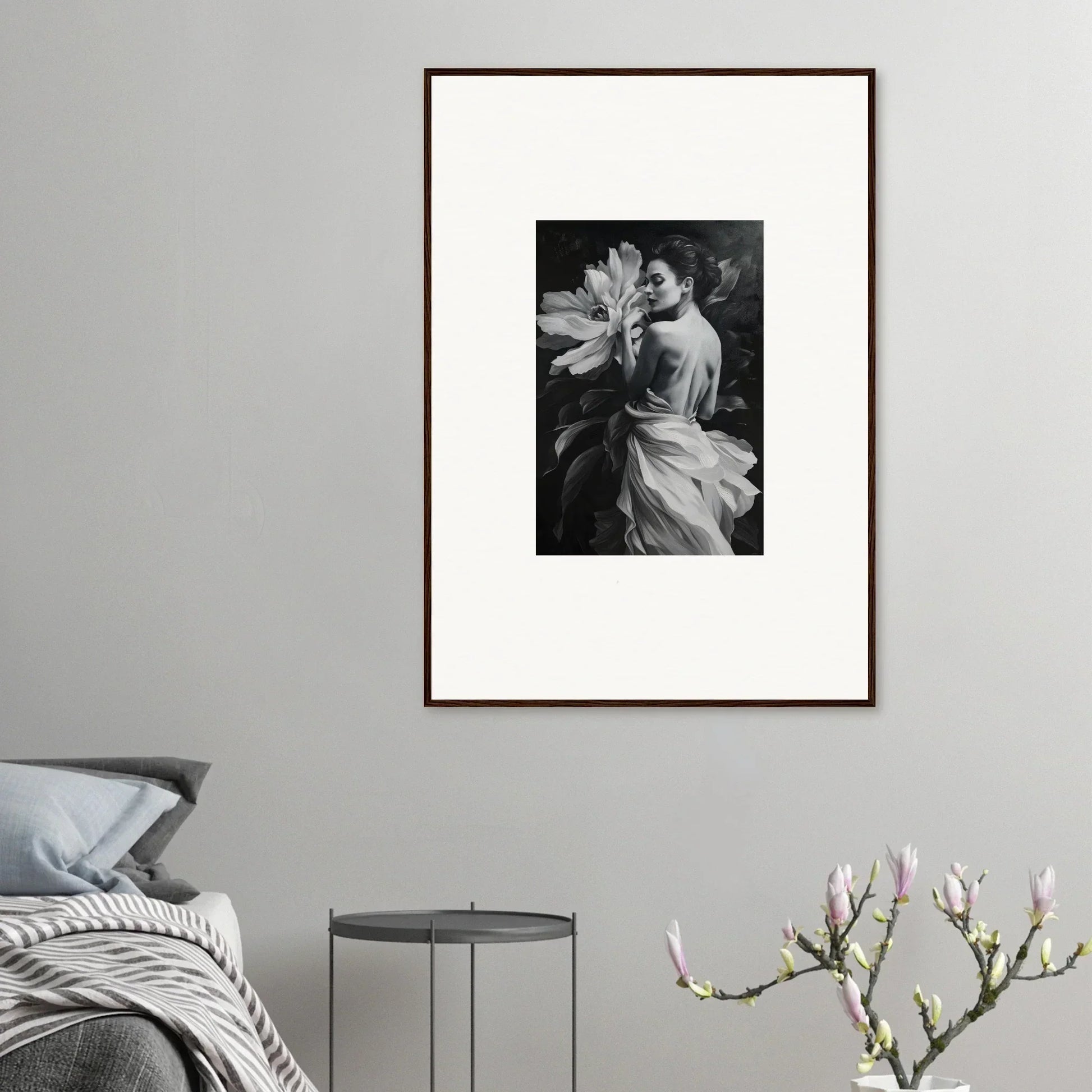 Framed black and white wall art of a person with a large flower for Room Decor