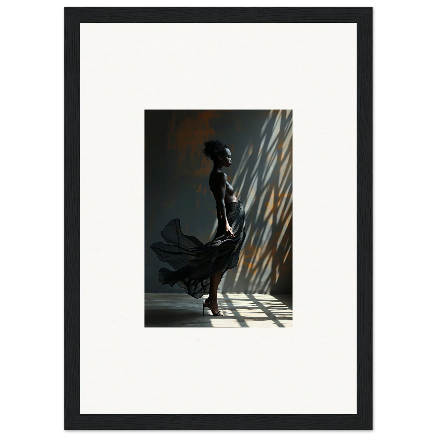 Framed artwork depicting a silhouetted figure standing in dramatic light and shadow.