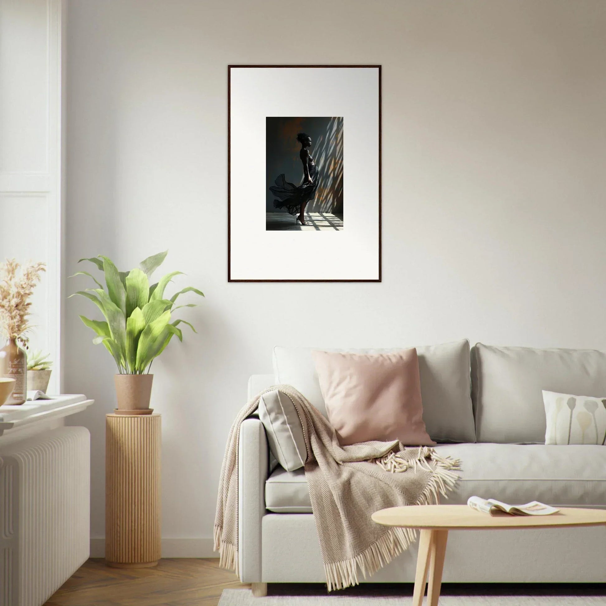 Framed black and white photograph of a person climbing a rock face.