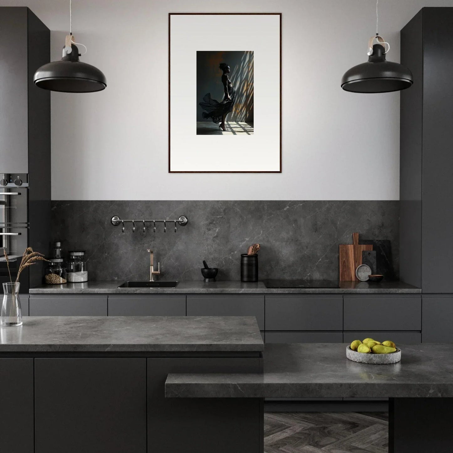 Modern kitchen with dark gray cabinetry and industrial-style pendant lights.