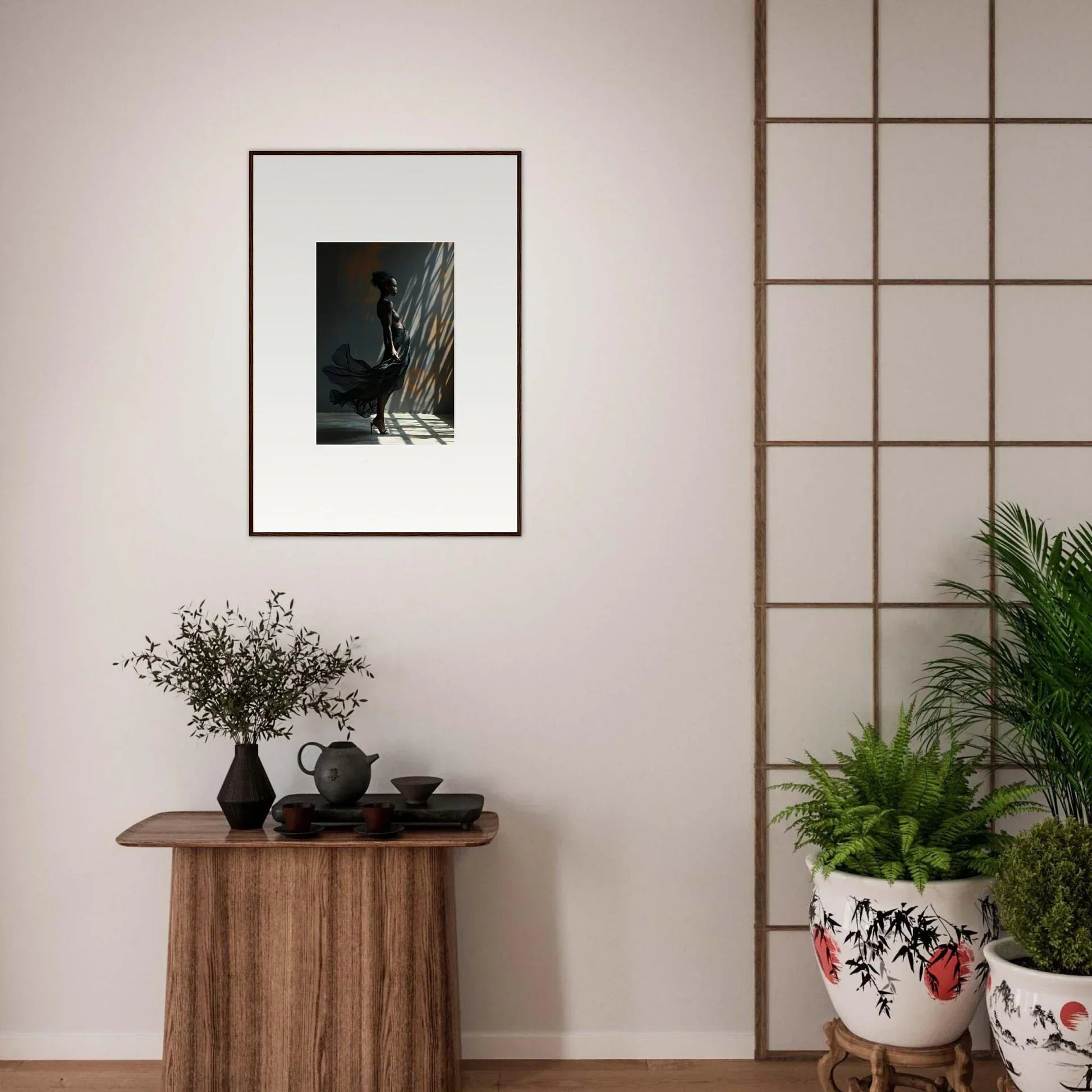 Framed black and white photograph hanging on a wall.