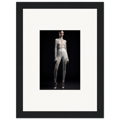 Framed black and white wall art of elegance wreathed in a form-fitting white outfit