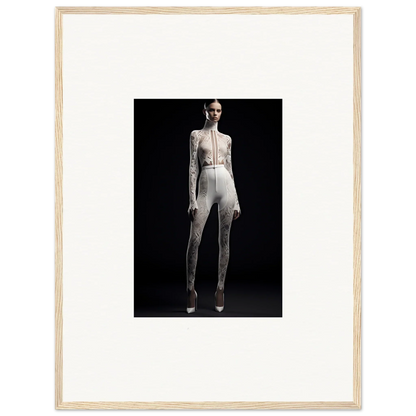 Framed wall art of a woman in a white jumpsuit, showcasing elegance wreathed style